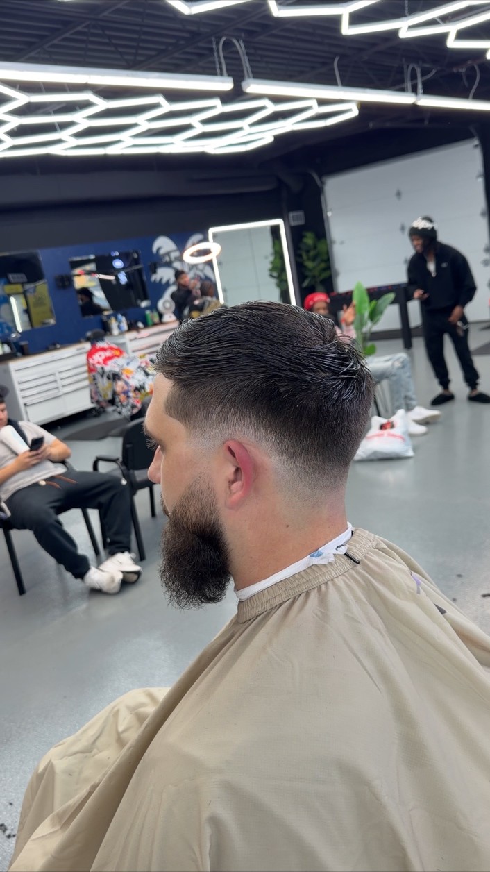 Side view of a finished haircut and shaped beard at Limited Barbershop